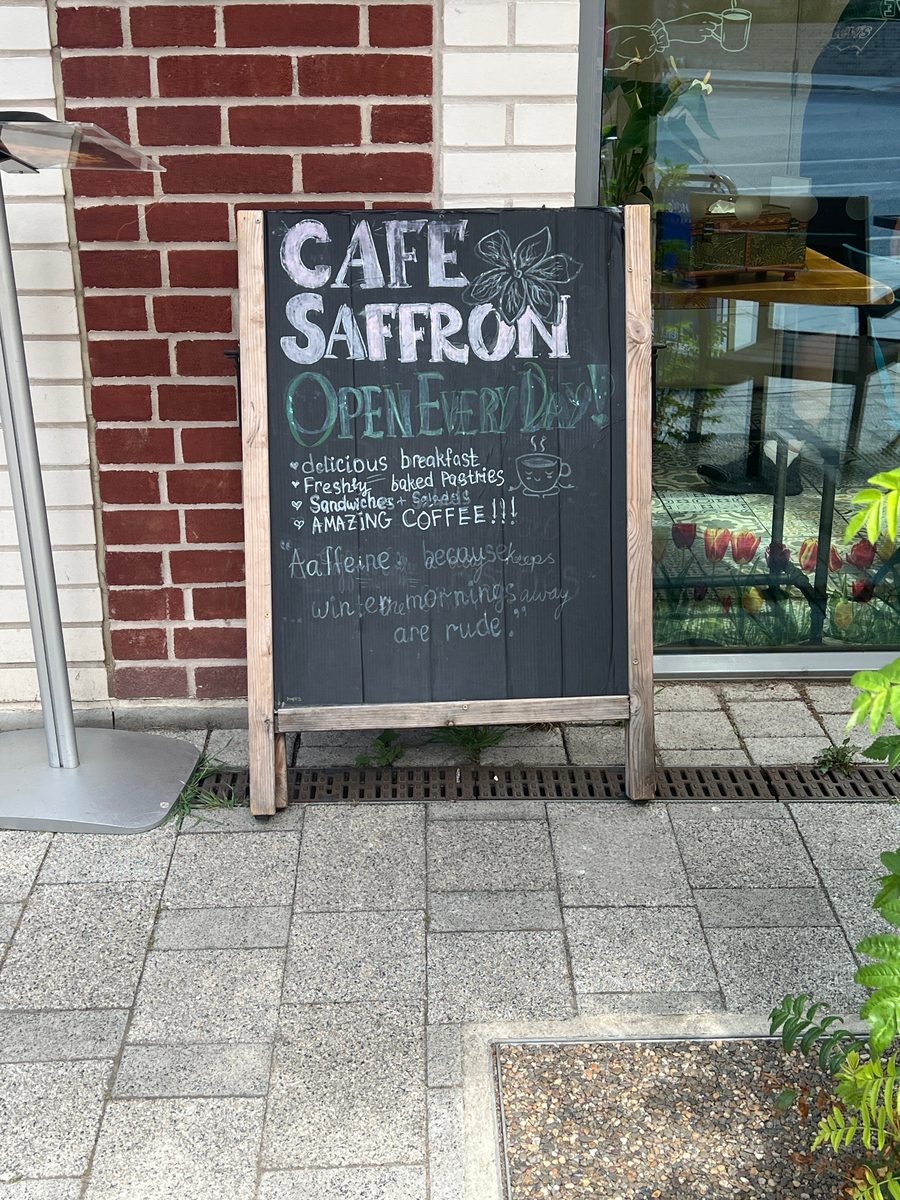 Café Saffron's pavement chalkboard reading Open Every Day